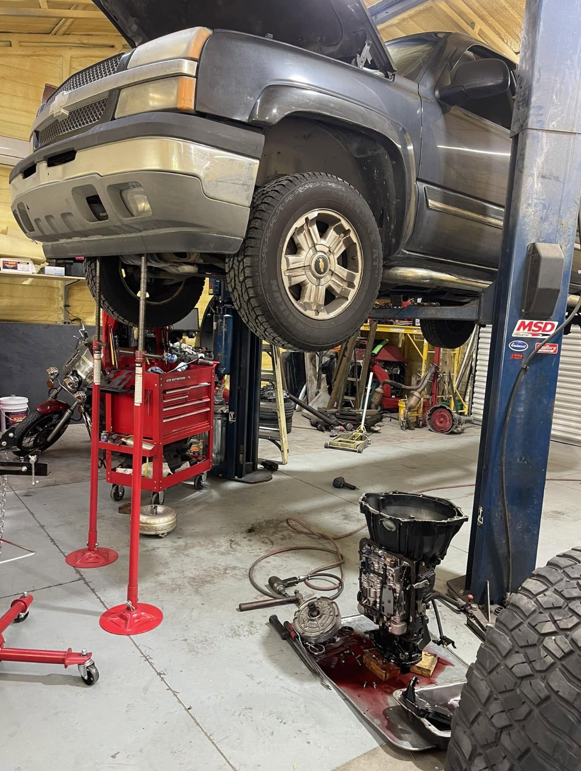 Truck raised on the lift for transmission work
